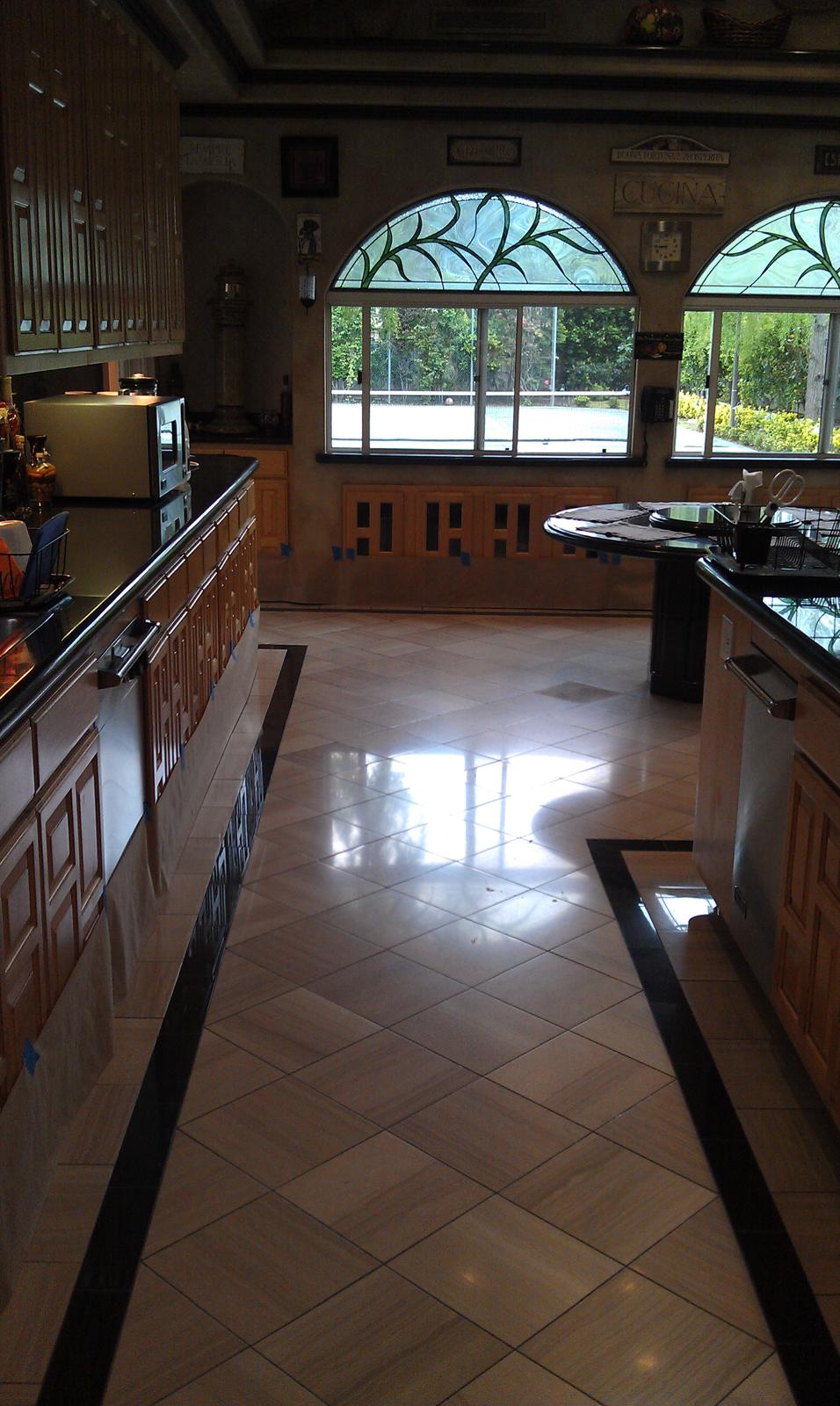 Same marble entryway after grinding and refinishing, with a level, smooth surface