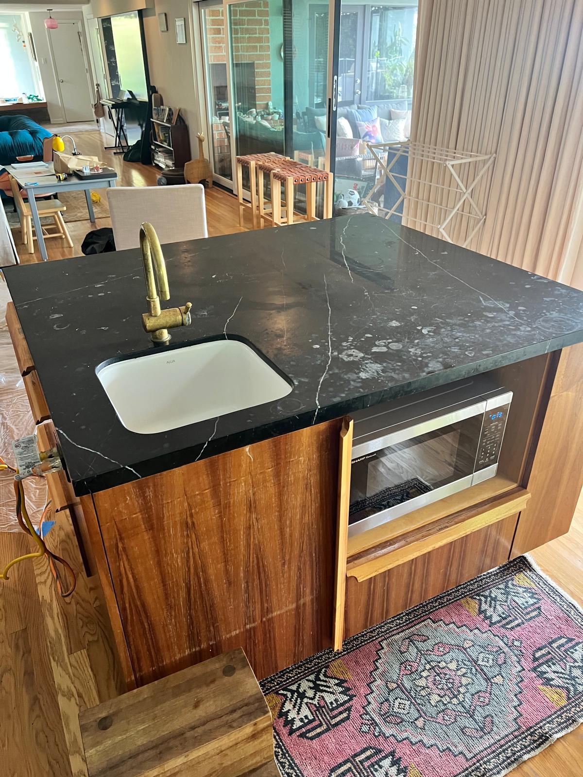 Travertine floor before deep cleaning, with visible dirt and wax buildup