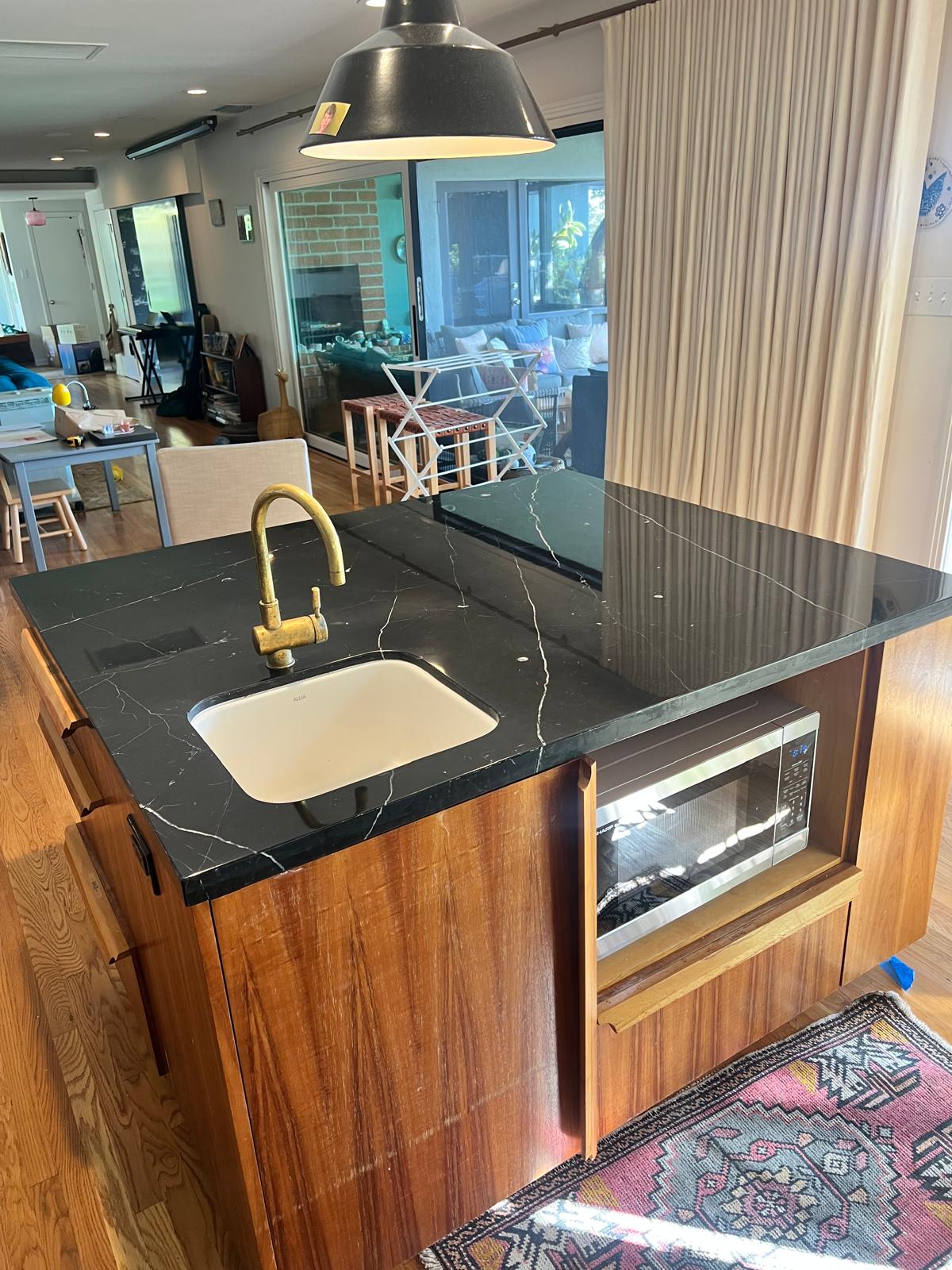 Same marble floor after stripping and resealing, with the natural finish restored