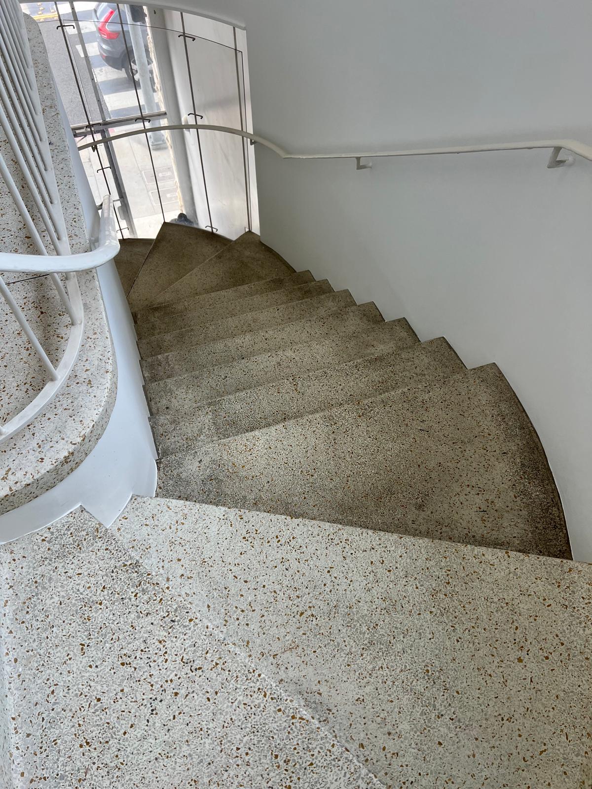 Dull terrazzo staircase before honing and finish restoration
