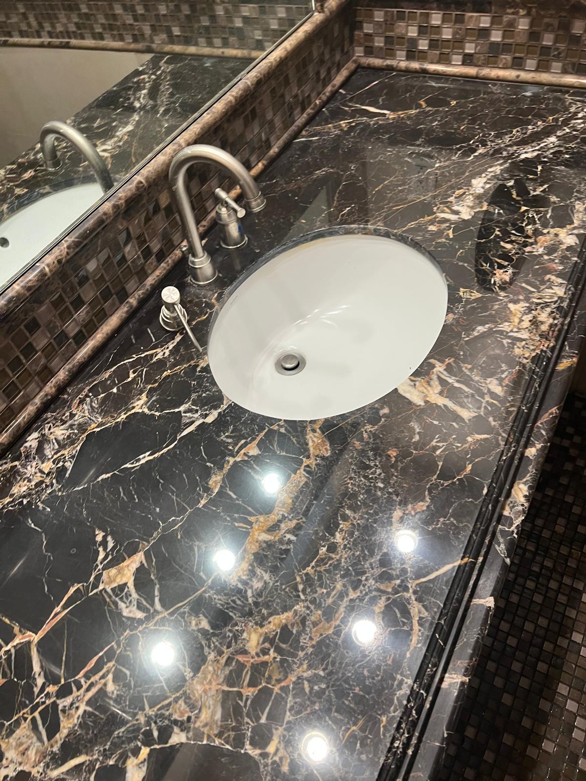 Black stone countertop with a restored mirror finish