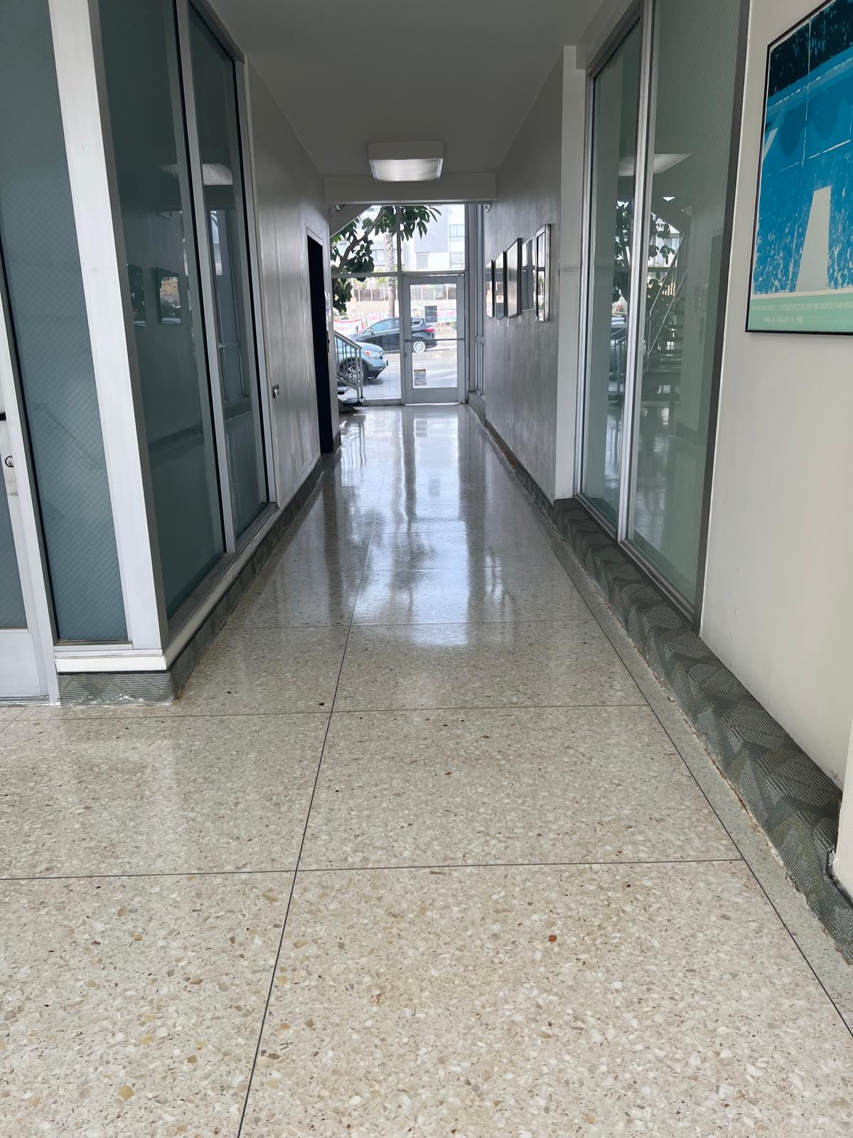 High-gloss terrazzo hallway floor after professional polishing