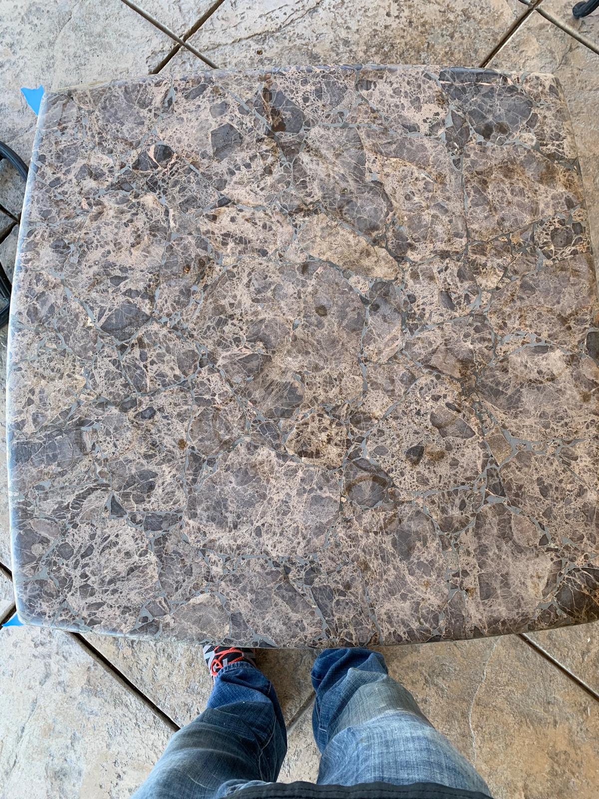 Polished grey-veined marble surface showing natural pattern and finish