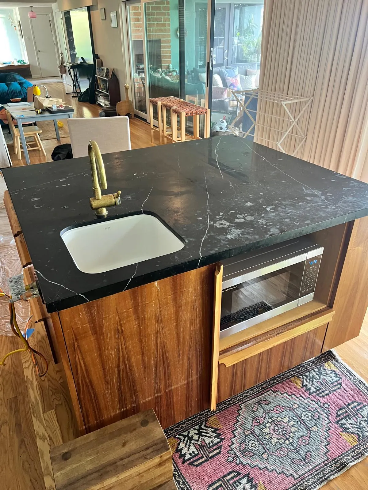 Travertine floor before deep cleaning, with visible dirt and wax buildup