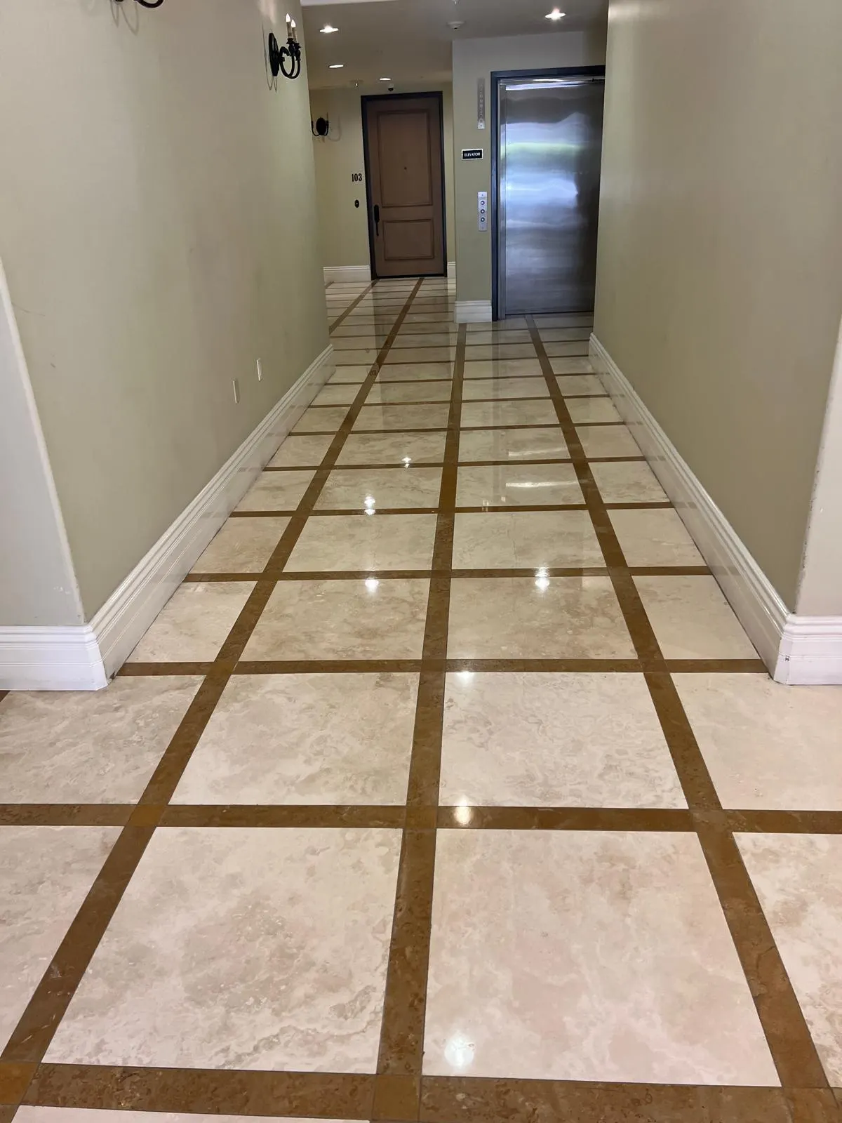 Highly polished commercial hallway marble floor